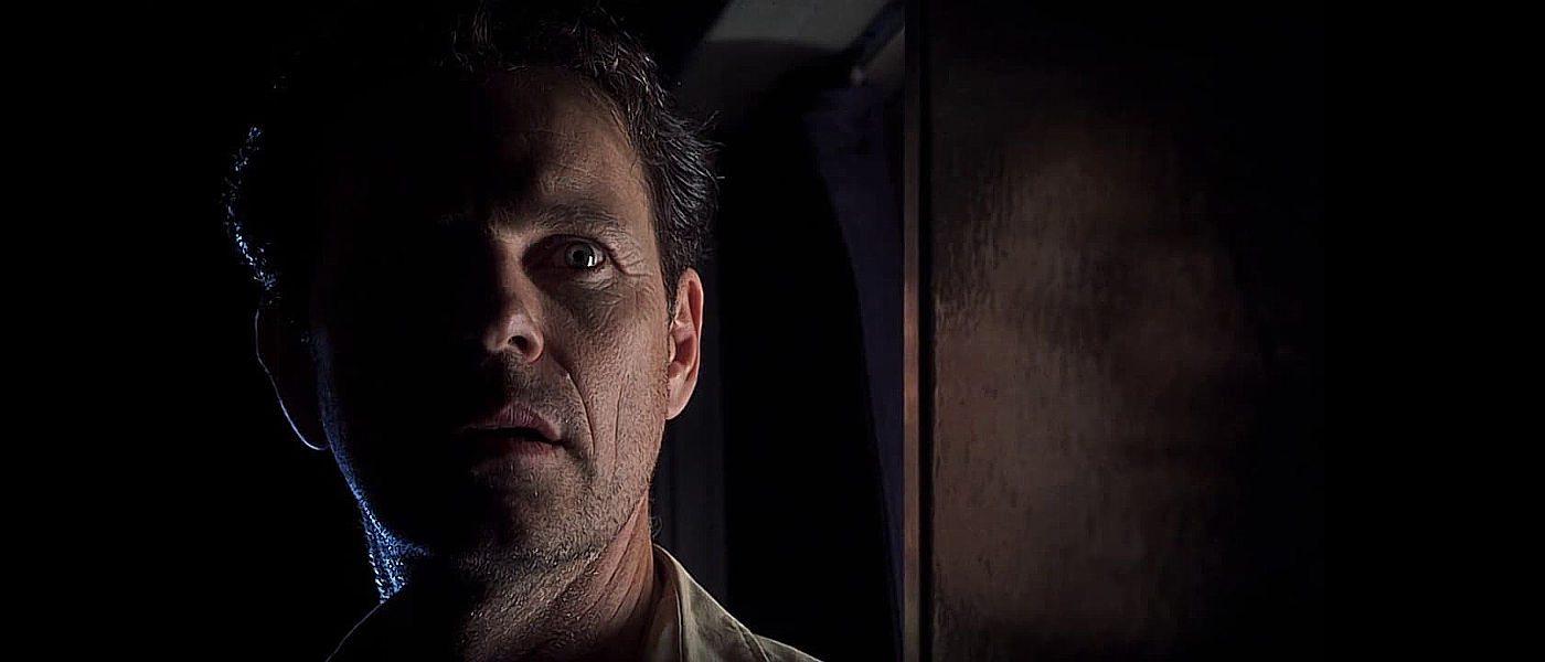 Below Bruce Greenwood